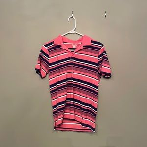 A nice coral and navy blue polo style shirt.